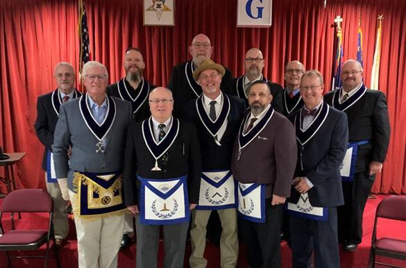 A group of men wearing sashes and tiesAI-generated content may be incorrect.